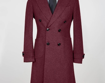 May include: A long, double-breasted coat in a deep wine red color. The coat has a classic design with a high collar and a single button closure at the wrist.