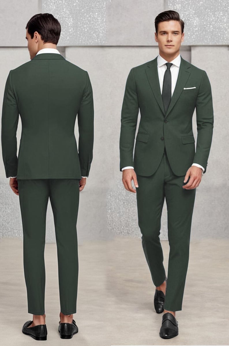 May include: A dark green suit with a single-breasted jacket and matching trousers. The jacket has a pocket on the left side and a button fastening. The suit is worn by a person with a white shirt and a dark tie.