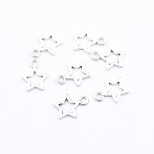 Silver ofylld stjärnberlock: 5 mm liten stjärna med ögla