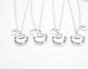 May include: Four silver necklaces with round pendants that say "Sister no matter what". Each necklace has a small oval pendant with the letter H, R, T, or M.