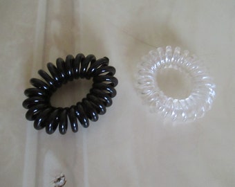 2 black and white twisted spiral hair elastics