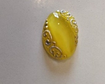 3 different oval resin or glass cabochons of different colors and dimensions