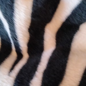 Fleece fabric in black and white with zebra patterns image 2