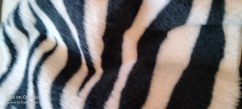 Fleece fabric in black and white with zebra patterns image 2