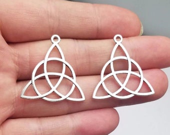 Silver Celtic knot pendants for jewelry creation, perfect for creating pretty jewelry