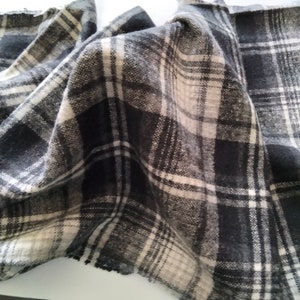 Black and gray tartan style fleece fabric image 1