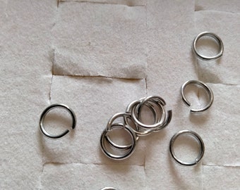 set di 10 anelli per saltare in acciaio inossidabile argentato