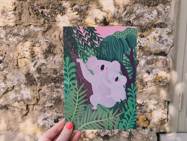 May include: A digital illustration of two koalas, a mother and baby, sitting in a lush green forest. The koalas are light pink and have black eyes and noses. The forest is filled with green leaves and branches.