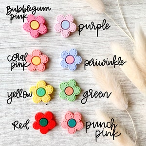 Flower needle minder magnets for sewing and embroidery in various color options.