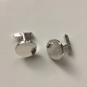 Vintage 1950s silver cufflink