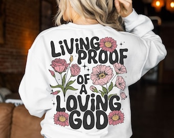 Camiseta bohemia "Prueba viviente de un Dios amoroso" (svg), sublimación cristiana retro, versículo bíblico de flores silvestres (PNG), fe floral (Svg), uso comercial