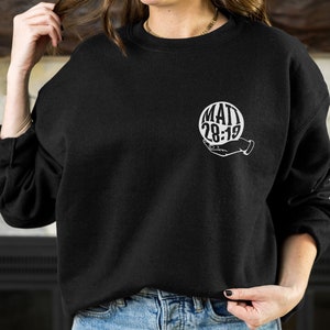 May include: Black sweatshirt with a white graphic of a hand holding a sphere with the text "MATT 28:19" inside.