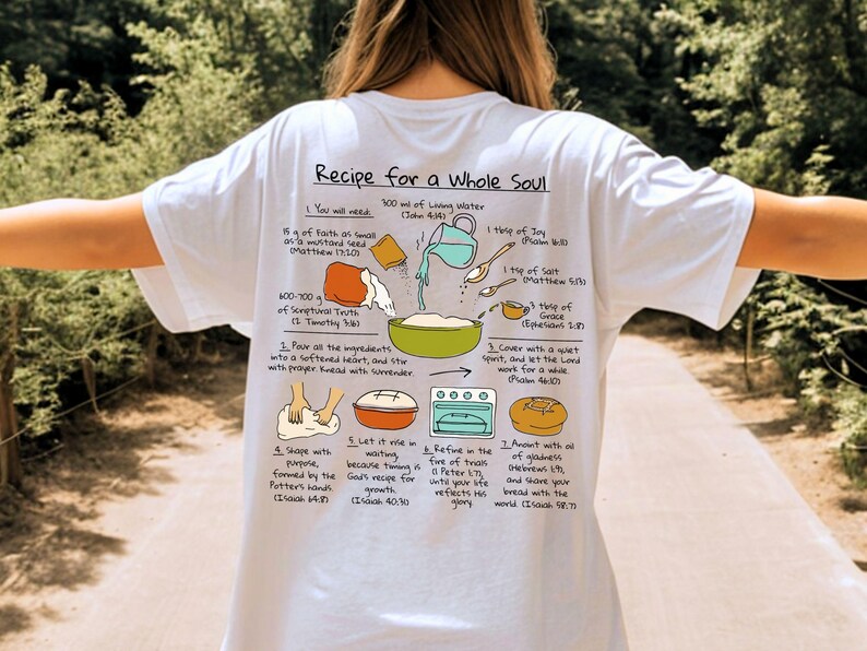 May include: White t-shirt with a graphic of a recipe for a whole soul. The recipe includes ingredients like faith, scriptural truth, and grace. The text is in black, with illustrations of the ingredients and steps.