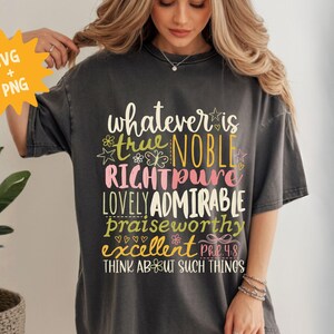 May include: Dark gray t-shirt with the words "whatever is true, noble, right, pure, lovely, admirable, praiseworthy, excellent" in a colorful design. The text also includes "Philippians 4:8" and "Think about such things."
