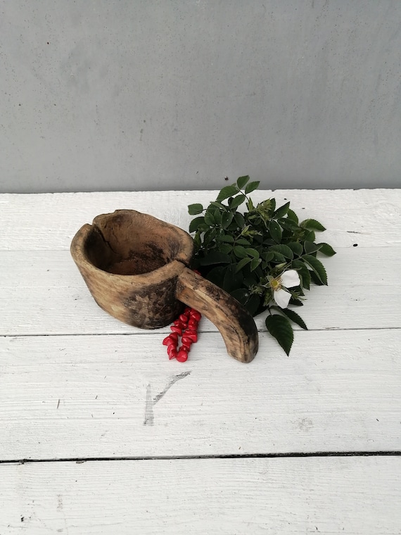A well-loved antique primitive dough bowl with 63 favorites backing it — the kind of weathered folk-art piece that anchors a farmhouse kitchen.