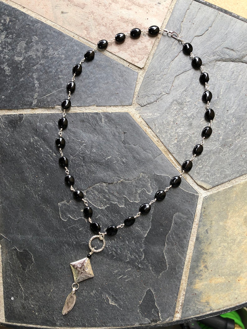 Clasp is a Silver Hook 19.5 inch Silver Wire Wrapped Onyx Bead Necklace with a 3 inch Silver and Onyx Pendent
