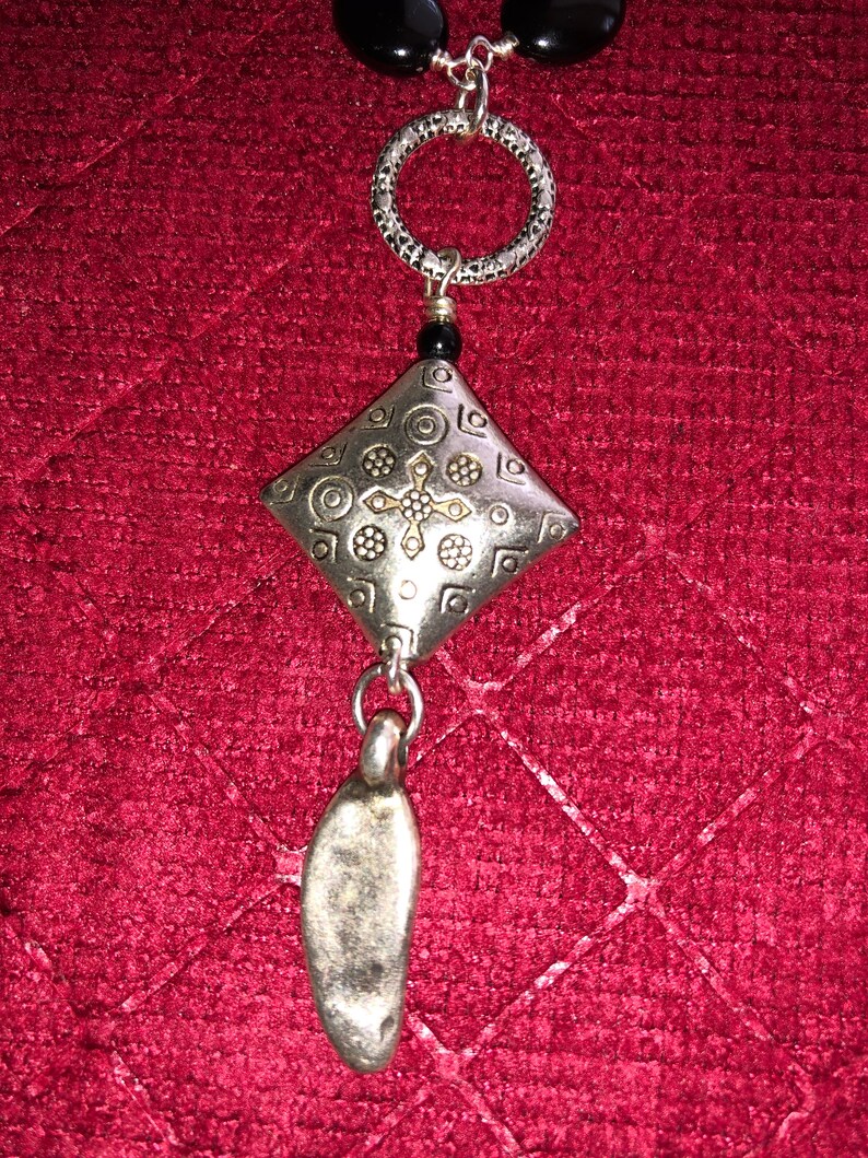 Clasp is a Silver Hook 19.5 inch Silver Wire Wrapped Onyx Bead Necklace with a 3 inch Silver and Onyx Pendent