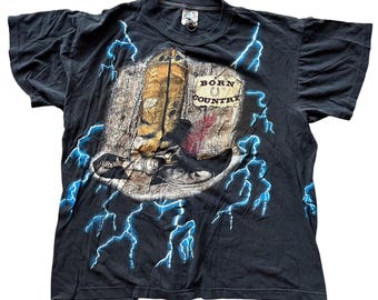 Camiseta vintage americana de los 90 con estampado integral de truenos y relámpagos "Born Country", para hombre, talla XL