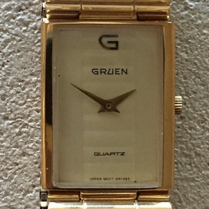 Vintage GRUEN mens japan qtz dress watch M.O.P dial NEW premium battery original flexband excellent condition runs well c/1980s