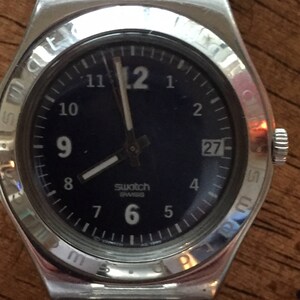 Swatch irony ladies watch  stainless steel blue dial w/date large white numbers new battery swiss made  ag1999 runs well