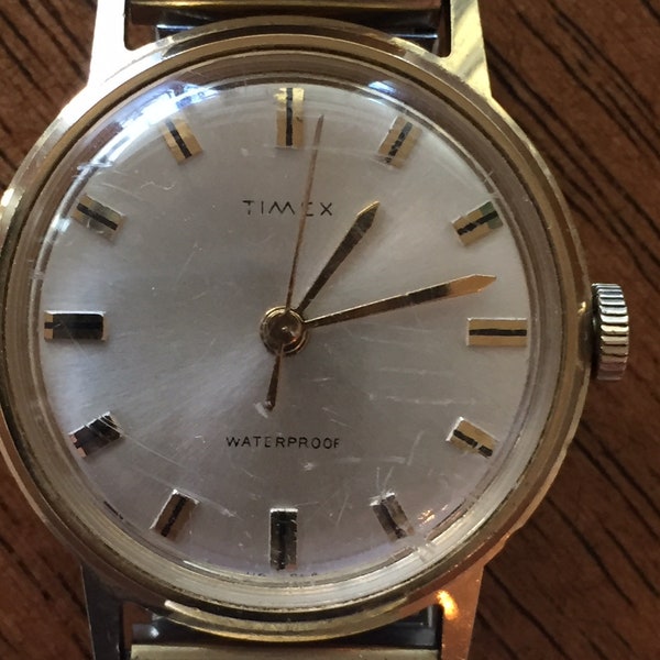 Vintage Timex unisex watch 32mm mechanical wind waterproof gold plated bezel stainless caseback /flexband runs well 1968