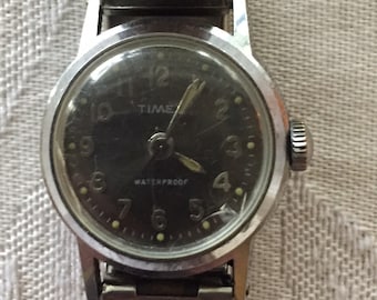 Timex vintage ladies watch black dial waterproof  mechanical wind 26mm stainless case back /flexband runs well c 1960s