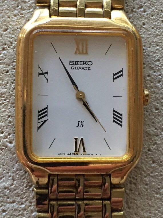 SEIKO mens SX dress japan quartz watch 27mm x35mm goldtone - Etsy Polska