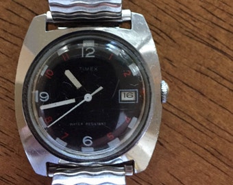 Timex vintage mens mechanical wind  w/date black dial white hands 35mm diameter raised dome crystal   1973 watch runs well