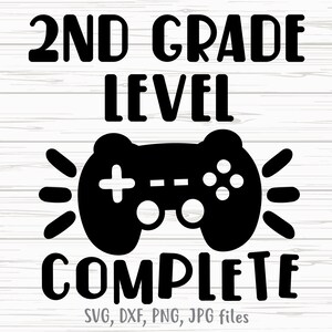 May include: Black and white graphic design with the text "2nd Grade Level Complete" and a video game controller with a glowing effect.  SVG, DXF, PNG, JPG files.