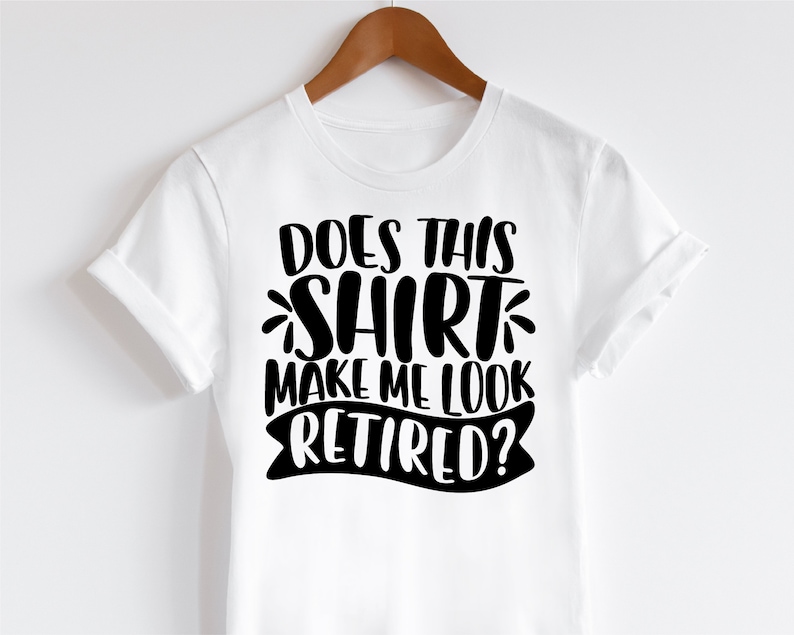 May include: White t-shirt with black text that reads "Does this shirt make me look retired?"