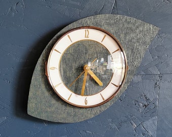Vintage asymmetrical silent wall clock from the 60s "Golden green"