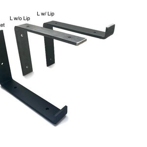 May include: Three black metal shelf brackets, labeled "J Bracket", "L w/o Lip", and "L w/ Lip".