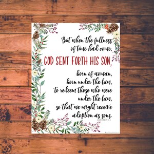 May include: A white printable Christmas card with a floral border and a red and white text overlay. The text reads "But when the fullness of time had come, GOD SENT FORTH HIS SON, born of woman, born under the law, to redeem those who were under the law, so that we might receive adoption as sons. GALATIANS 4:4-5"