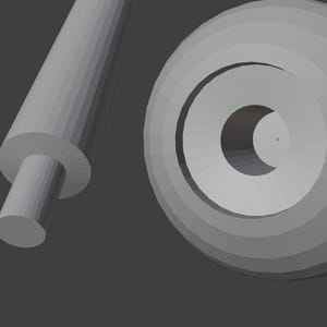 May include: A gray, 3D-rendered image featuring a cylindrical rod with a smaller, circular end, and a circular object with concentric rings and a central hole. The objects are set against a gray background.