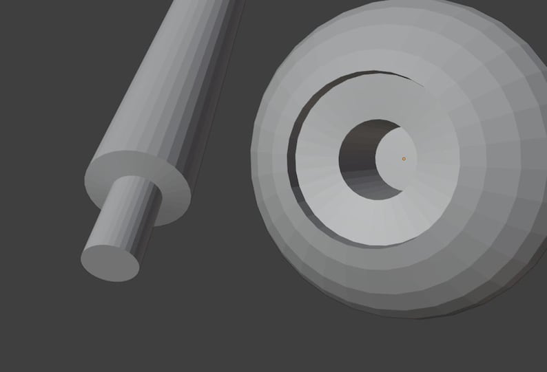 May include: A gray, 3D-rendered image featuring a cylindrical rod with a smaller, circular end, and a circular object with concentric rings and a central hole. The objects are set against a gray background.