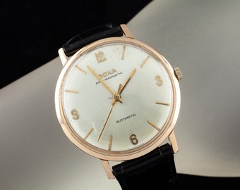 Reloj automático Doxa antimagnético para hombre en oro rosa de 14 quilates con correa de piel negra, Ref. 11565