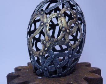 The Year 2000 Egg, carvedgoose eggshell with aged metal patina