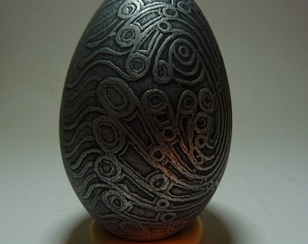 Papaztac, acid etched engraved goose eggshell with aged metal patina