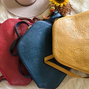 red leather, blue leather and yellow leather backpack purse for women