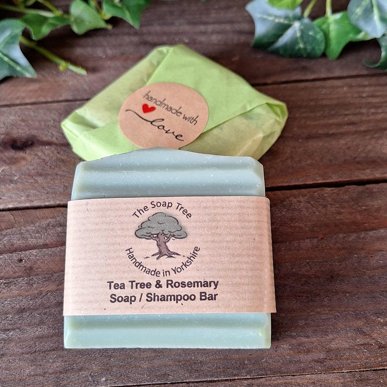 May include: A light green Tea Tree & Rosemary Soap / Shampoo Bar from The Soap Tree, handmade in Yorkshire, with a brown paper label. The soap is wrapped in green paper and a round sticker that says "handmade with love".