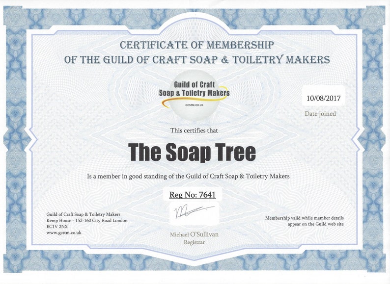 May include: A certificate of membership for The Soap Tree, a member in good standing of the Guild of Craft Soap & Toiletry Makers. The certificate is dated 10/08/2017 and includes the Guild's registration number 7641. The certificate is signed by Michael O'Sullivan, Registrar.