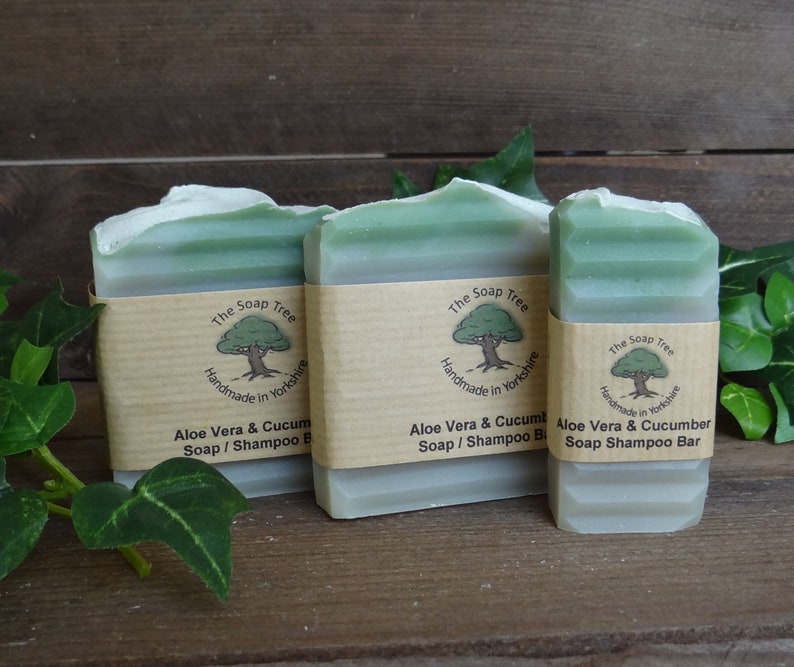 May include: Three bars of green soap with white labels. The labels have a tree logo and the text "The Soap Tree Handmade in Yorkshire Aloe Vera & Cucumber Soap/Shampoo Bar".