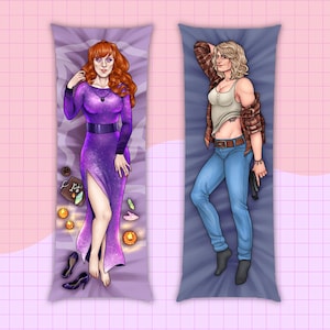 May include: Two rectangular body pillows featuring illustrated characters. The left pillow shows a person with red hair in a purple dress with a high slit, surrounded by crystals and candles. The right pillow shows a person with blonde hair in a white tank top, plaid shirt, and blue jeans holding a black handgun.