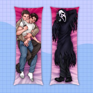 May include: Two body pillow covers. One features two men embracing, one holding a knife. The other depicts a figure in a black robe and a white mask, holding a phone. Both are on pink backgrounds.