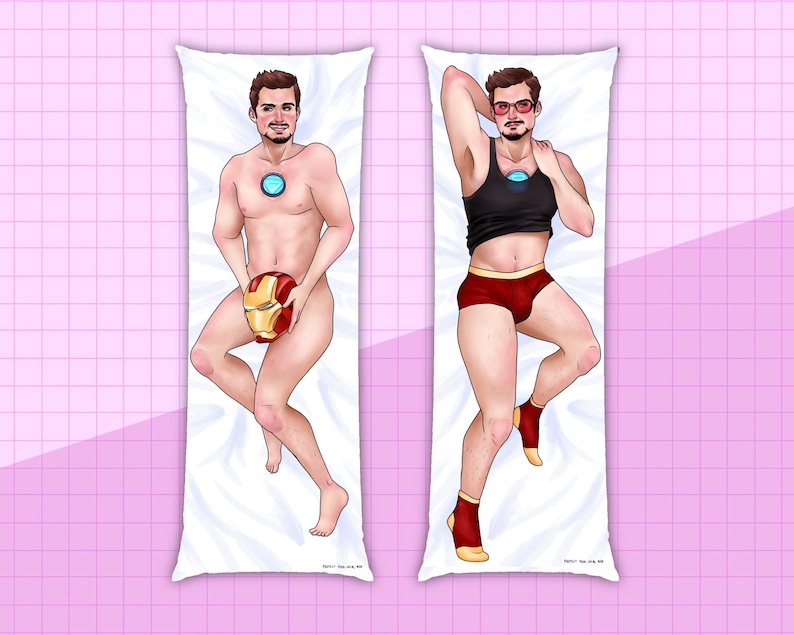 May include: Two body pillow cases featuring a man in different poses. One pillow case shows the man wearing a black tank top and red underwear. The other pillow case shows the man holding a red and gold helmet. Both pillow cases have a white background.