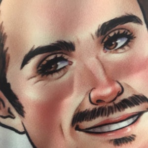 May include: Close-up of a man's face with brown hair, brown eyes, and a light brown beard. He is smiling with his teeth showing.