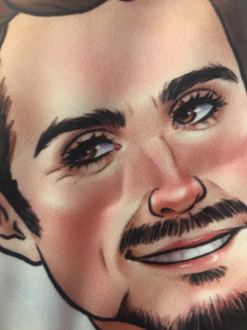 May include: Close-up of a man's face with brown hair, brown eyes, and a light brown beard. He is smiling with his teeth showing.