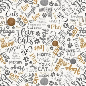 May include: A cream-colored fabric with a repeating pattern of cat-themed words and phrases in black, gray, and gold. The words "I Love Cats", "Hugs", "Meow", and "Cats Rule" are prominent, along with paw prints and yarn balls.