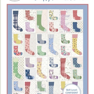 May include: A quilt pattern featuring a colorful array of socks, with a white background. The pattern is titled "Lost Socks" and is described as "Scrappy fun with fabric!" The pattern is for a quilt that can be made in two sizes: Throw and Twin. The skill level is listed as "Confident Beginner".