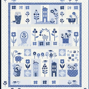 May include: A blue and white patchwork quilt featuring a repeating pattern of houses, flowers, birds, and baskets. The quilt has a blue border and a variety of patterned squares. The overall design is a charming, country-style theme.